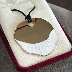 Robert Lee Morris Gold and White Textured Pendant Necklace. Genuine leather.